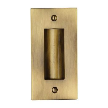 Flush door handle for sliding doors and pocket doors in antique brass finish Flush door handle for sliding doors and pocket doors in antique brass finish