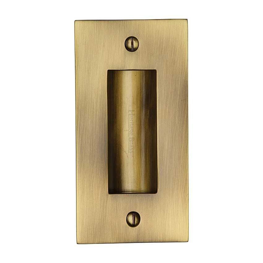 Flush door handle for sliding doors and pocket doors in antique brass finish