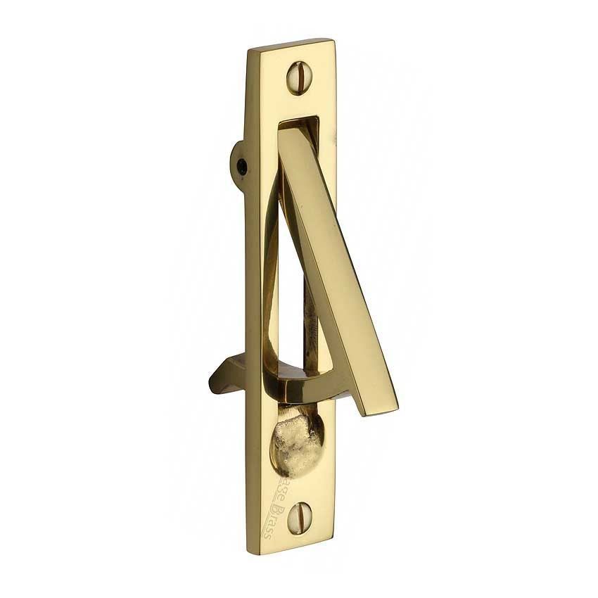 Sliding door and pocket door edge pull in polished brass finish.