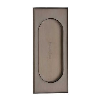 Flush door handle for sliding doors and pocket doors in matt bronze finish Flush door handle for sliding doors and pocket doors in matt bronze finish