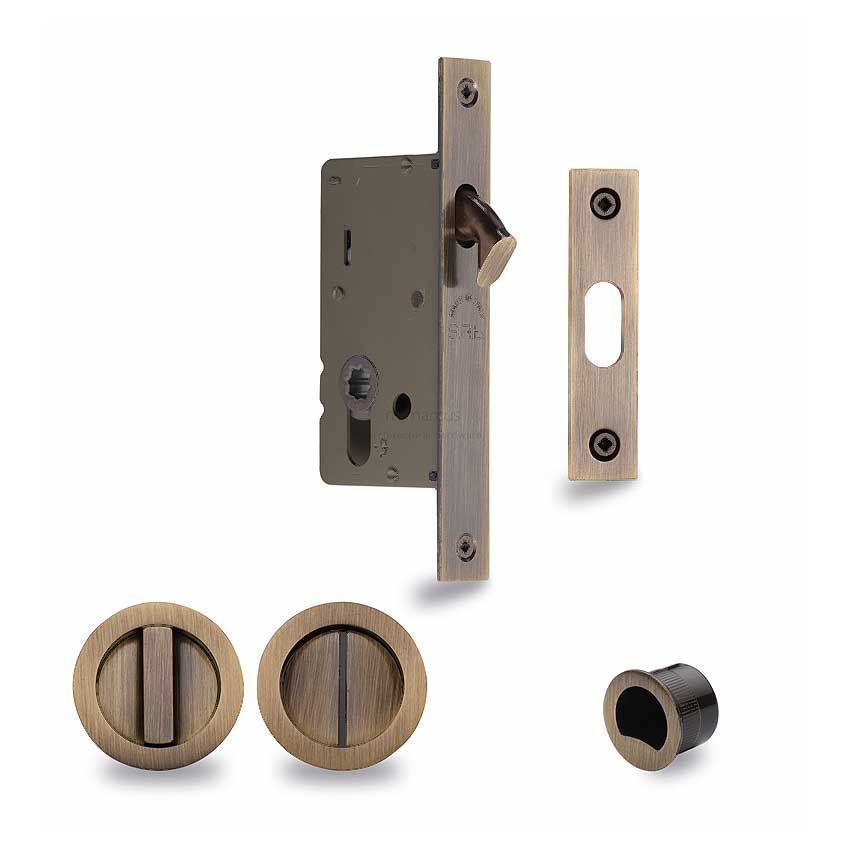 Sliding Lock with Round Privacy Turns In Antique Brass Finish - RD2308-40-AT