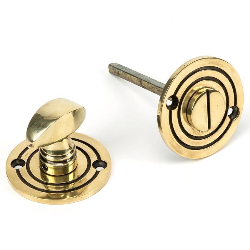 Round Bathroom Thumb turn in Aged Brass - 83804