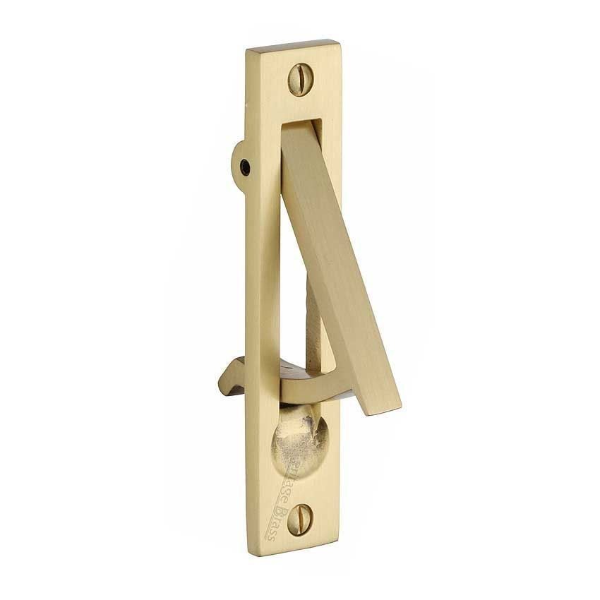 Sliding door and pocket door edge pull in satin brass finish.