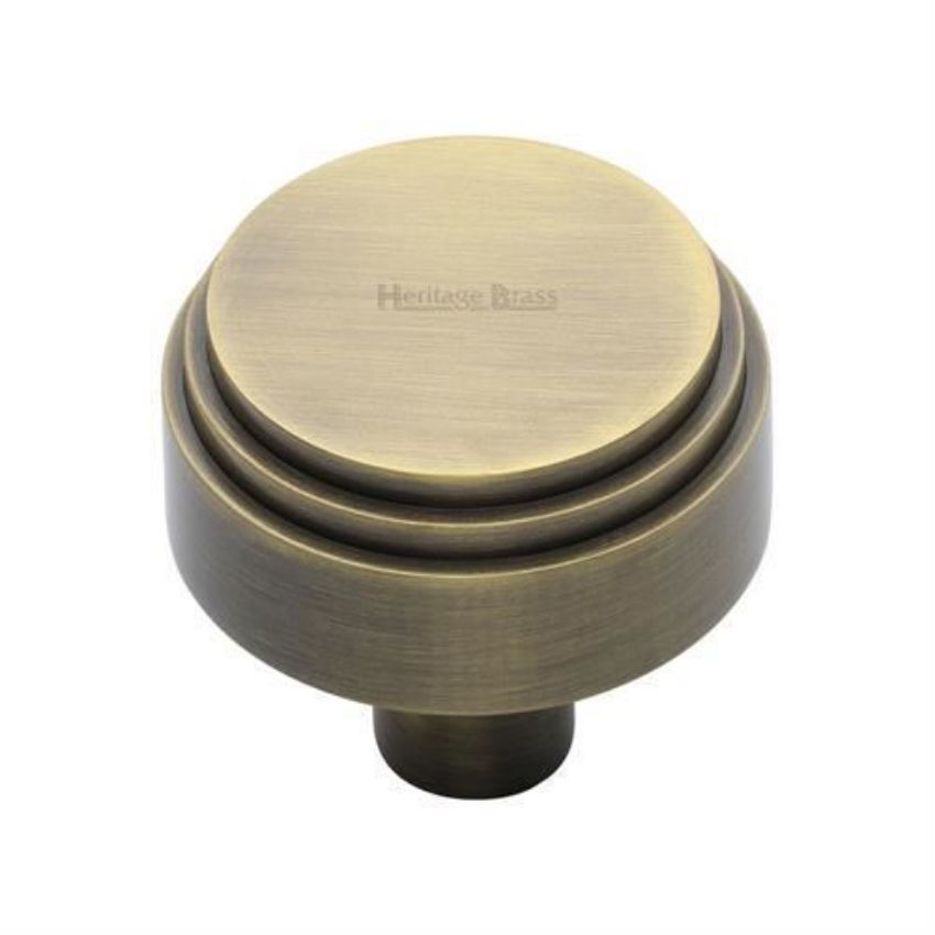 Round Deco Cabinet Knob in an Antique Brass Finish - C3987-AT