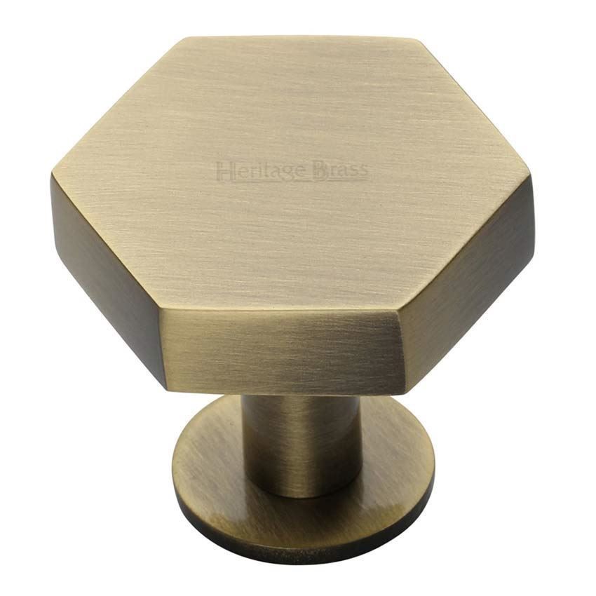 Hexagon Cabinet Knob on a Rose in Antique Brass Finish - C4345-AT