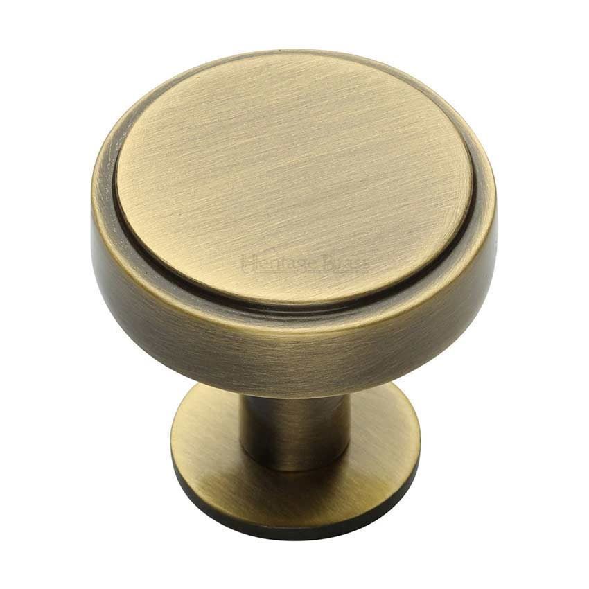 Stepped Disc Cabinet Knob on a Rose in Antique Brass - C3954-AT 