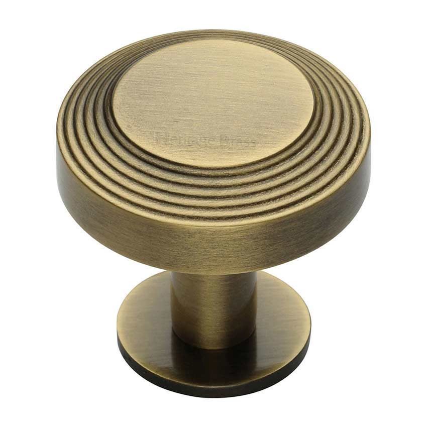 Ridge Cabinet Knob on a Rose in Antique Brass - C3958-AT 