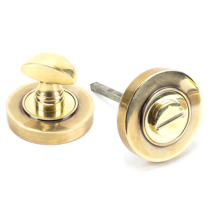 Aged Brass Round Thumbturn on a Plain Round Rose - From the Anvil - 45731