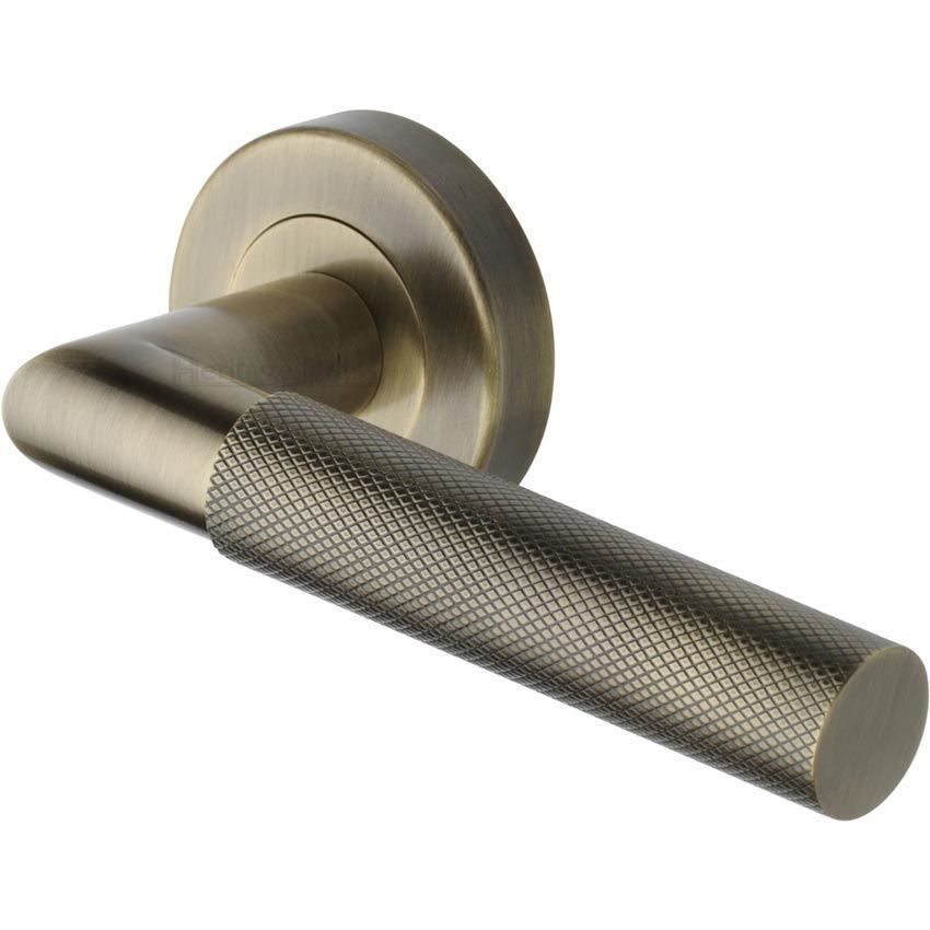 Bauhaus Mitre Knurled Door Handle on Round Rose in Antique Brass - V2272-AT