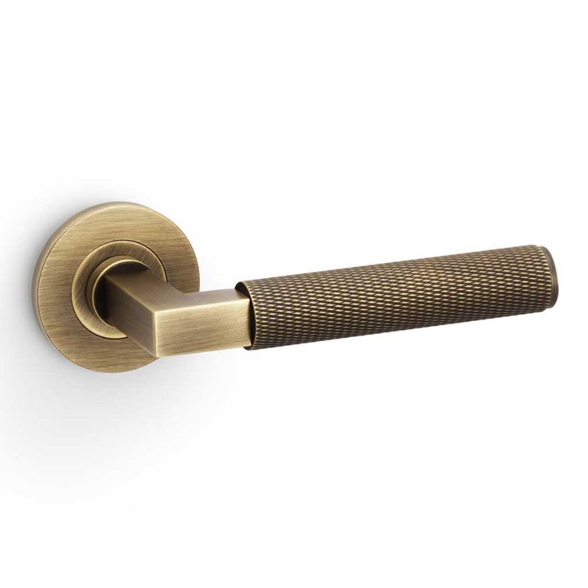 Picture of Hurricane Knurled Door Handle on Round Rose in Antique Brass - AW200AB