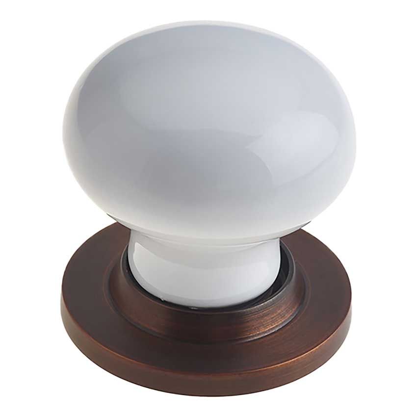Picture of White Porcelain Mortice Door Knob on a dark bronze rose  - JC10+JC80RDB