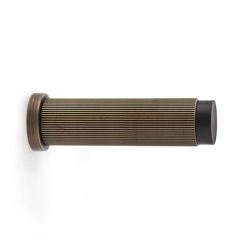 Picture of Alexander and Wilks Reeded Projection Door Stop in Antique Brass - AW602-75-AB