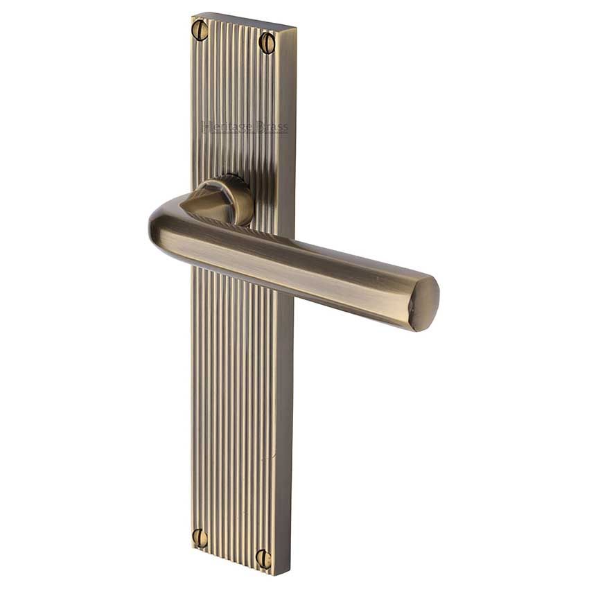 Picture of Octave Reeded Backplate Door Handles In Antique Brass Finish - RR3710-AT-GP