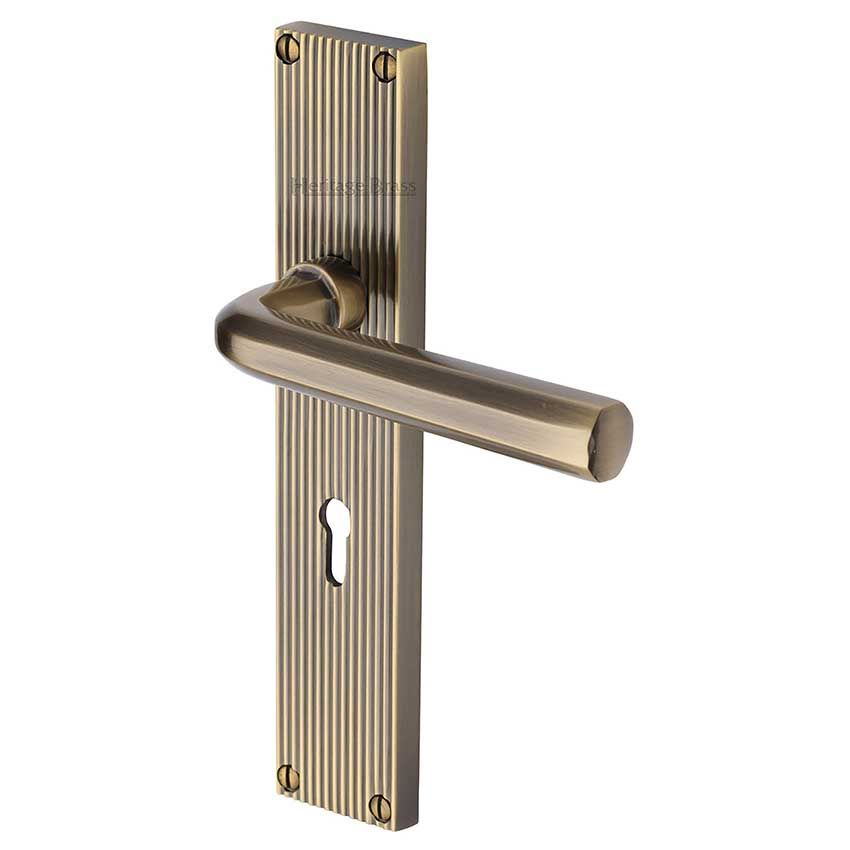 Picture of Octave Reeded Backplate Lock Door Handles In Antique Brass Finish - RR3700-AT-EXT