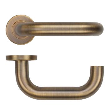 Picture of Tubular Return to Door Lever on Round Rose In Antique Brass - ZCS2080G3AB