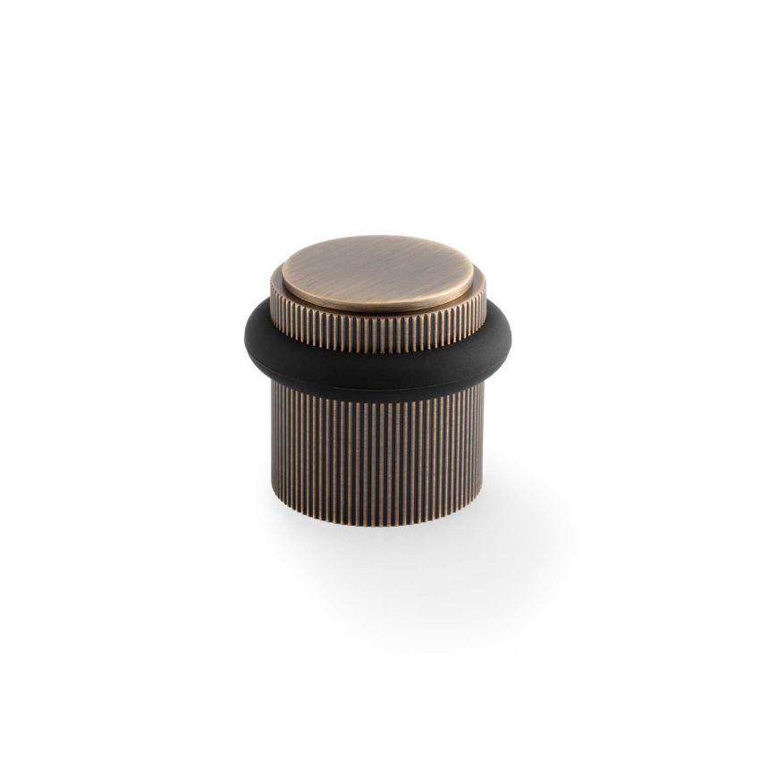 Picture of Brunel Reeded Floor Mounted Doorstop In Antique Brass- AW639RAB