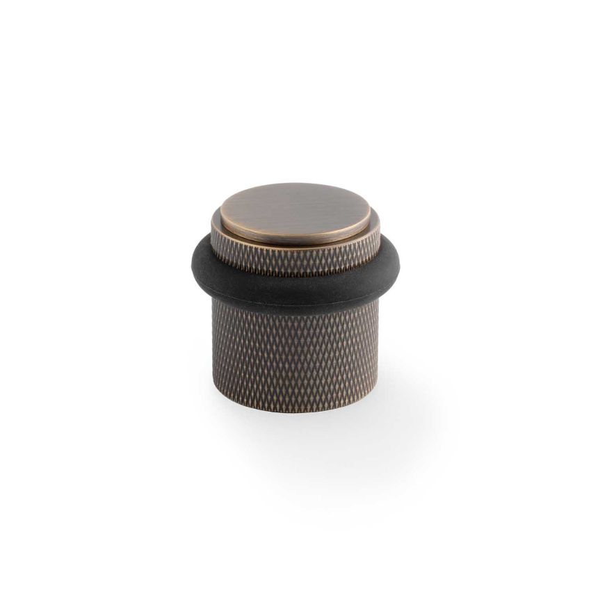 Picture of Brunel Knurled Floor Mounted Doorstop In Antique Brass- AW639KAB