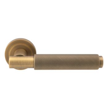 Picture of Varese Knurled Door Handle on Round Rose- Antique Brass - EUL050AB